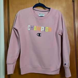 Light purple Champion sweatshirt with multicolored lettering on front